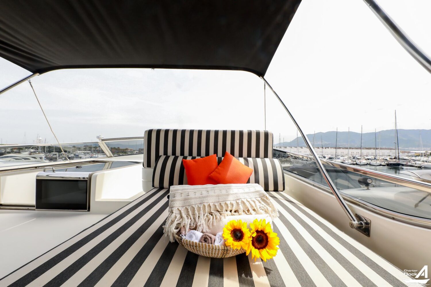 Elegant super yacht cruising against a stunning sunset backdrop."